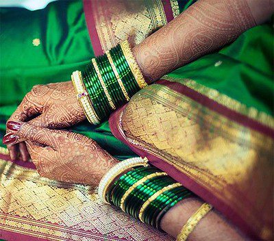 Chooda - green bangles worn by Maharashtrian brides Image courtesy Parekh Cards via Flickr