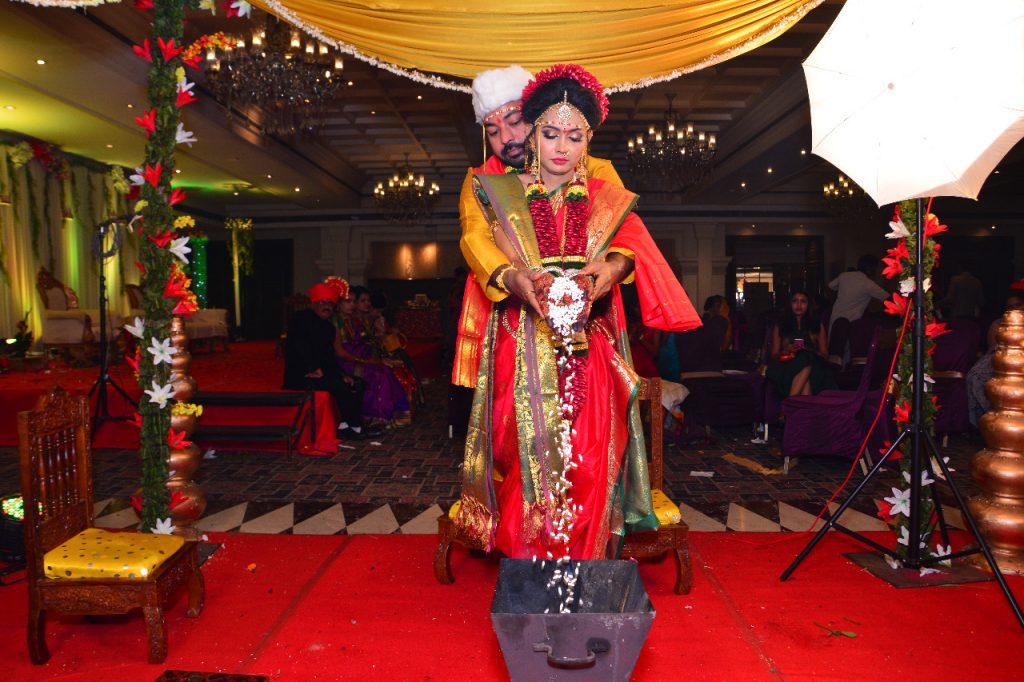 Marathi wedding rituals  Giving aahuti to the havan after saptpadi Image courtesy: Harshal Chopkar via Wikipedia Commons