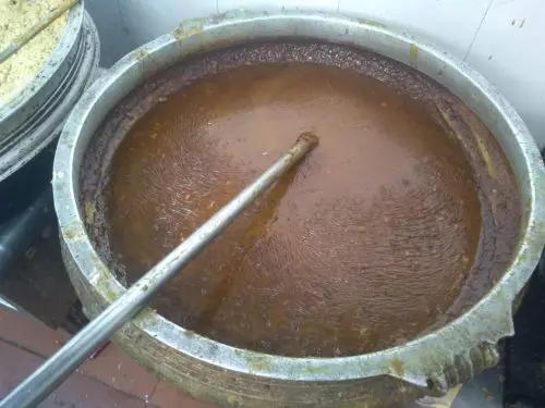 Food being cooked in a uruli in Home Kitchens ( (Image courtesy Poonam Singh)