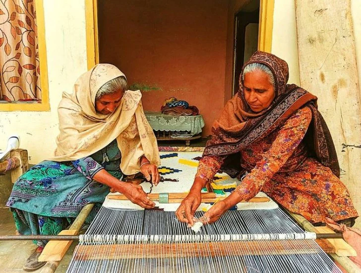 weaving Indian cotton dhurries is a vital economic activity for many rural communities in India