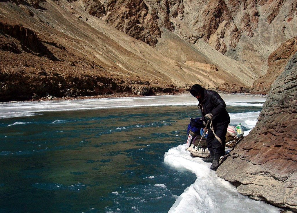 Trekking in the beautiful terrain of the frozen Zanzkar River via Wikimedia Commons